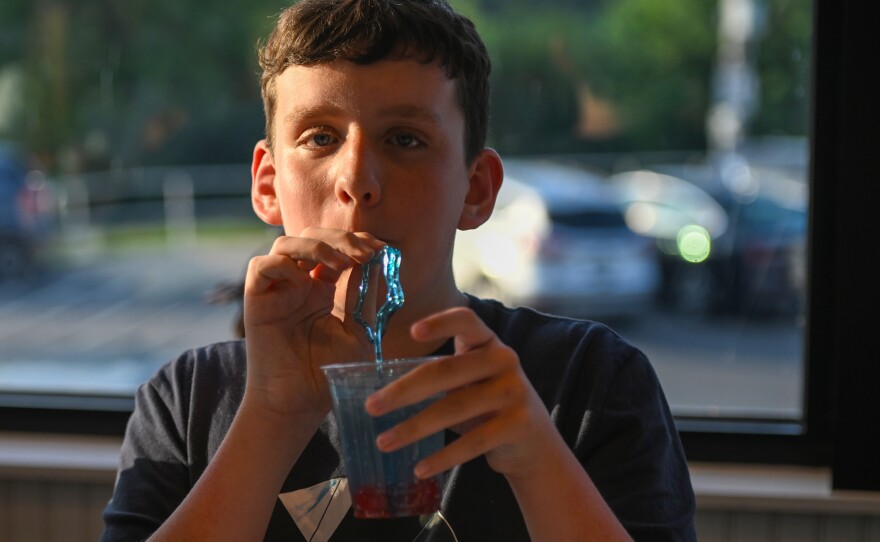 Alex Clark tries a Fourth of July themed drink he made during the cooking class.