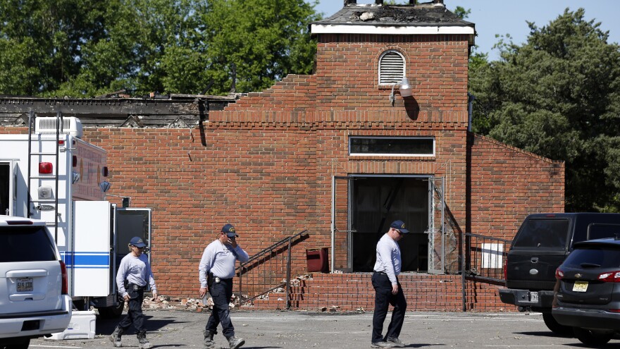 Investigators from the Bureau of Alcohol, Tobacco, Firearms and Explosives work on Wednesday near the ruins of Mt. Pleasant Baptist Church, one of three black churches that recently burned down in Louisiana.