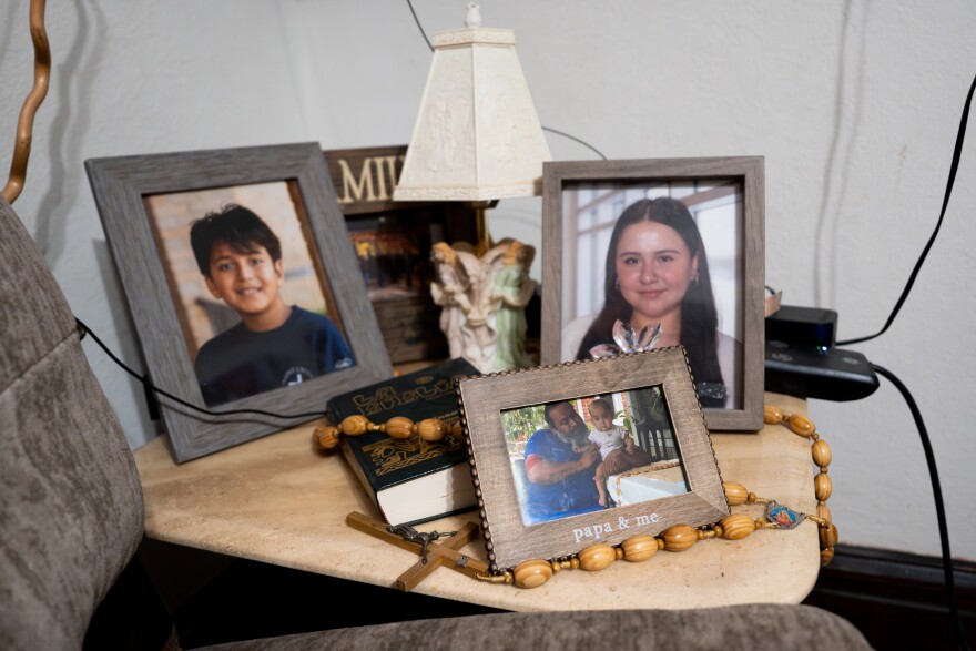 Portraits of Danny and Maria Estrada’s family line the tables at their Dutchtown home on Wednesday, Dec. 10, 2025, in south St. Louis. The couple were the first to participate in the St. Joseph Housing Initiative’s homebuyers program.