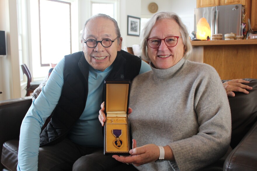 Hank Bailey and Leslie Lee hold the Purple Heart. (Photo: Ellie Katz/IPR News)
