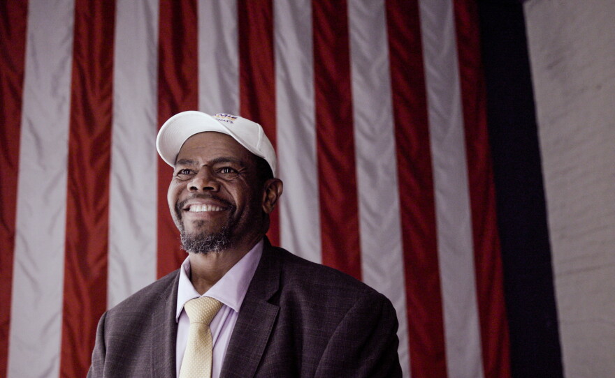 Jamie Davis, the Democratic candidate for the U.S. Senate seat previously held by Sen. Bill Cassidy, stands in front of an American flag at a campaign stop at the WWII museum on Thursday, October 15, 2026, in New Orleans.