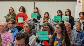  Members of the Rogue Climate Action Team hold signs in support of a proposed electrification ordinance in Ashland, March 21, 2023