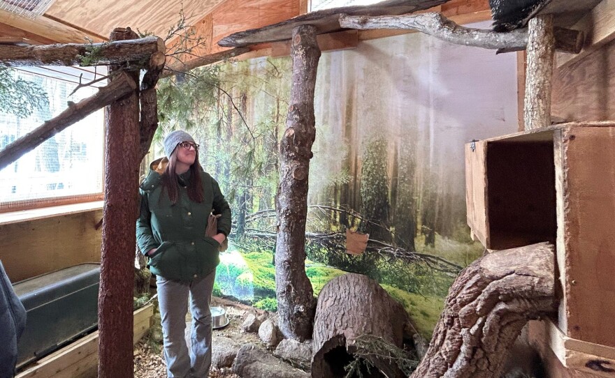 Executive Director Kristen Lamb visits Poppy, one of the Center for Wildlife ambassadors.