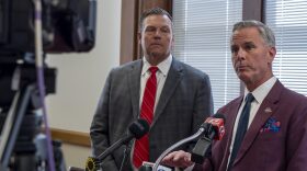 Kansas Bureau of Investigation director Tony Mattivi, right, and Attorney General Kris Kobach talk to reporters during an Oct. 1, 2025, news conference on illegal retail sales of marijuana and THC products.