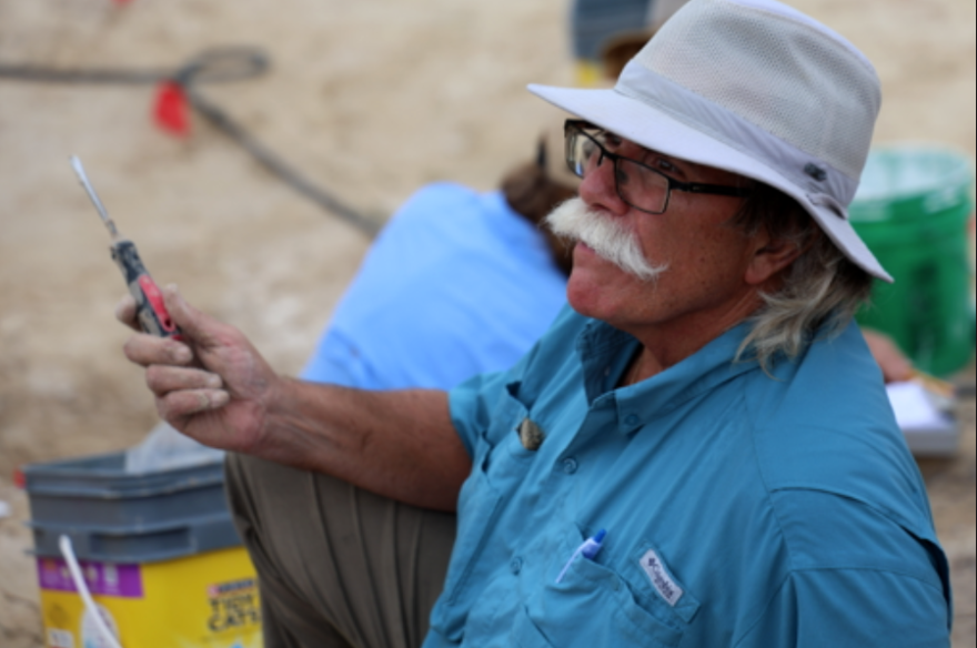 Volunteer Paul Rogalle shows off his digging tool at the Montbrook fossil site in Levy County.