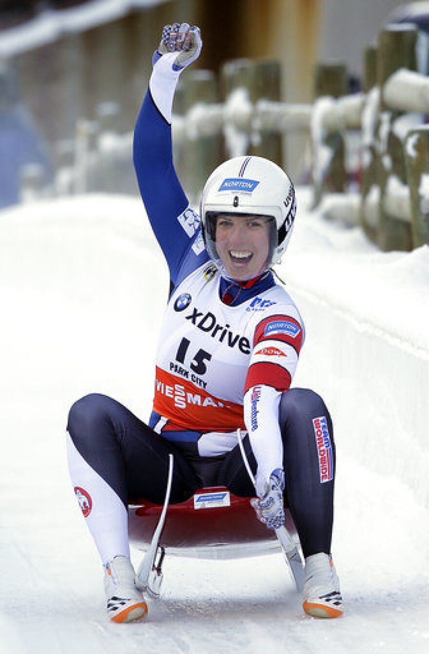 FILE - In this Dec. 17, 2016, file photo, Erin Hamlin, of the United States, celebrates as she slides to the finish after a women's World Cup Luge sprint event in Park City, Utah. Hamlin came in first place. This is not a gold-medal-or-bust season for USA Luge star Erin Hamlin, who is bidding for a fourth Olympic appearance. She’s getting married next summer and is likely headed toward retirement, but she’s still one of the elite sliders in her sport. (AP Photo/Rick Bowmer, File)