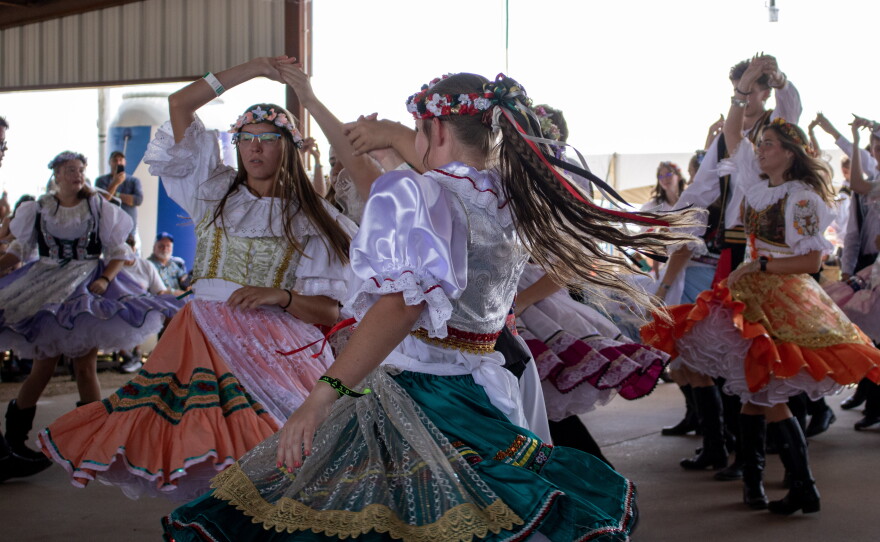 Members of West's Junior Historians dance polka during the 50th anniversary of Westfest on Saturday. The group has been performing at Westfest since its creation in 1976.