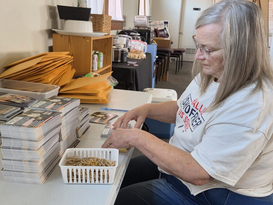 Cindy Henry organizes postcards for Hallie Shoffner’s U.S. Senate bid at the campaign’s Little Rock headquarters on Sept. 3, 2026.