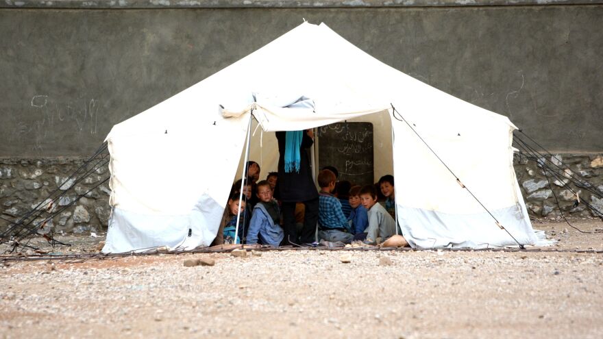 Afghan children attend class in a tent in Bamiyan province, west of Kabul, on June 3. A shortage of buildings is just one of a host of problems the Afghan educational system faces.