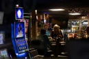 Slot machines light up the front window of a bar in Golconda, Illinois.