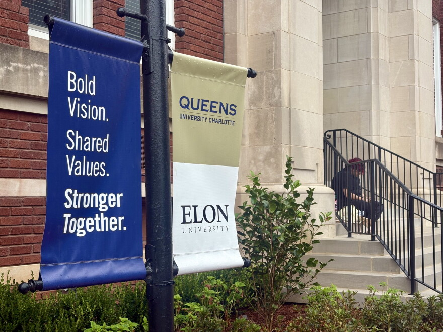 Banners announcing the merger between Queens University and Elon University were seen on the Queens campus on Sept. 23, 2026.