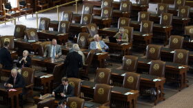  Empty seats are seen in the House Chamber at the Texas Capitol, Tuesday, July 13, 2021, in Austin, Texas. Texas Democrats left the state to block sweeping new election laws, while Republican Gov. Greg Abbott threatened them with arrest the moment they return.