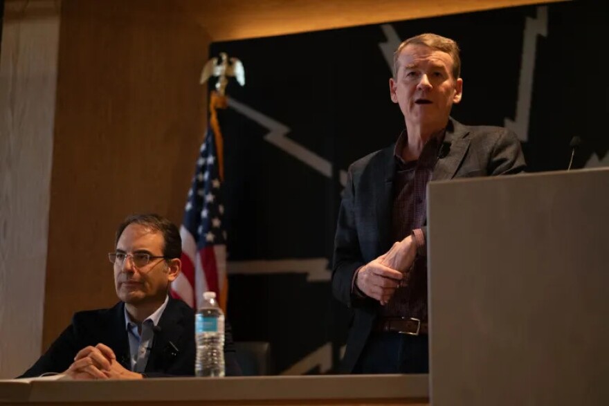 Colorado Attorney General Phil Weiser, left, and U.S. Sen. Michael Bennet at a debate hosted by the Colorado Young Democrats in Denver, Colorado, on Saturday, Jan. 10, 2025.