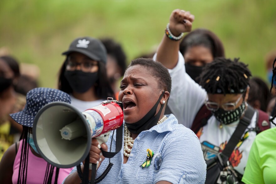 Thomas leads her late son's family and high school friends on a march to his grave in August. She is demanding changes in public safety after first responders took nearly 40 minutes to arrive to the site where he drowned.