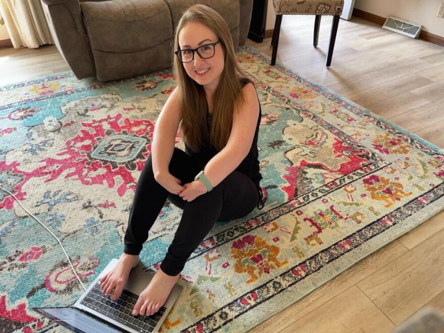 Journalist Sarah Kovac was born with a rare birth defect that left her arms and hands underdeveloped. She does most tasks with her feet, everything from typing and making coffee to driving and changing her kids' diapers. (Courtesy of Sarah Kovac)