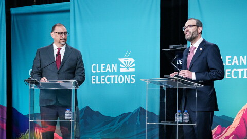 Democrat Secretary of State Adrian Fontes, left, argues Wednesday night with Republican challenger Alexander Kolodin.