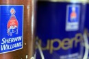 Closeup of cans of paint with a Sherwin Williams logo