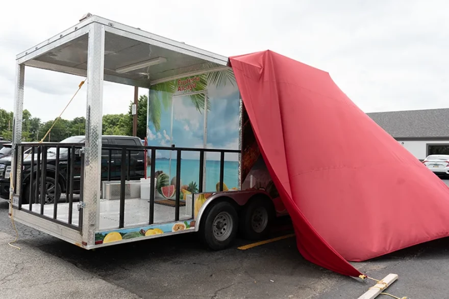 The vendor of an Olathe fruit stand was detained by ICE in July 2026.