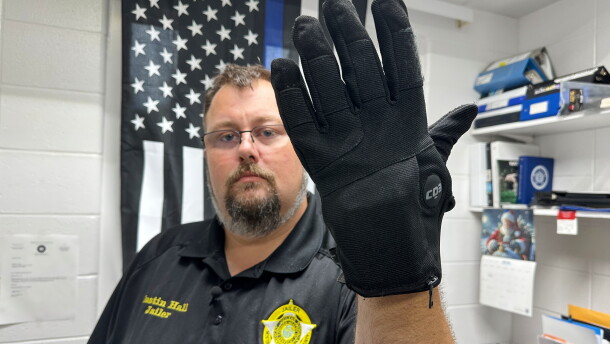 Nelson County, Ky., jailer Justin Hall shows an electric shock glove that is used at his facility, Thursday, Aug. 13, 2026, in Bardstown, Ky. (AP Photo/Dylan Lovan)