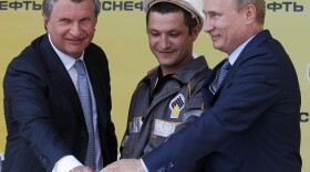Russia's President Vladimir Putin (R) and CEO of state-controlled Russian oil company Rosneft Igor Sechin (L) push the button launching a new oil terminal at the Black Sea port of Tuapse on June 15. An expected fall in crude prices this autumn could have serious impacts on the economies of Russia and other nations reliant on oil exports.