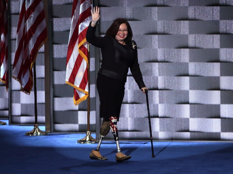 Sen. Tammy Duckworth walks across stage at the Democratic National Convention in 2016. She is the first senator to give birth while serving in office.
