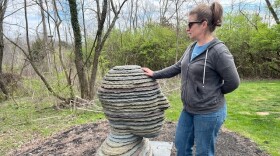Melanie VanHouten with one of the sculptures at Josephine Sculpture Park in Franklin County