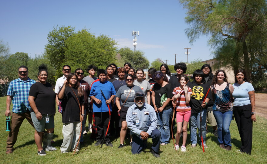 6th through 12th grade youth and adults from this year's Johnson O'Malley summer program posed for a group photo during their archery lesson.