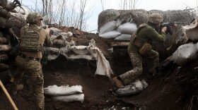Ukrainian soldiers keep their position in a trench on the front line with Russian troops in Lugansk region.