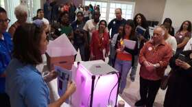 Teachers get trained on how to construct their new veggie boxes. Photo: Daniel Rivero WLRN