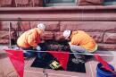 Contractors with Otto Baum Company of Morton are extracting eroded sandstone blocks from Peoria City Hall. They'll be replaced with sandstone from the former downtown Bergner's store that the city keeps in storage.