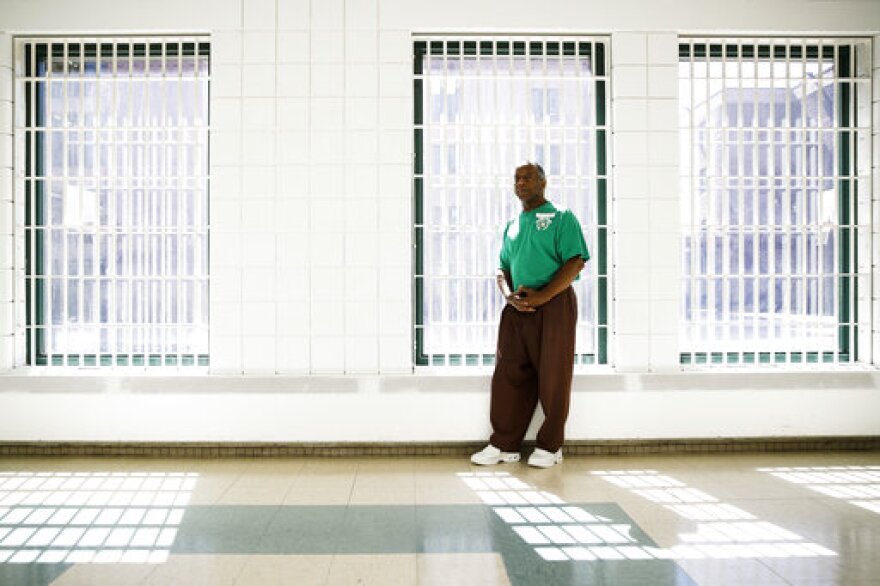 In this Thursday, Aug. 29, 2019 photo incarcerated filmmaker Ezra poses for a portrait at the State Correctional Institution in Chester, Pa. Eastern State Penitentiary, a former prison that's now a museum in Philadelphia is showcasing the work of currently incarcerated filmmakers, projecting the animated shorts onto its outside walls. The new exhibit titled “Hidden Lives Illuminated” offers a glimpse into the lives of these inmates to passersby and museum visitors alike. (AP Photo/Matt Rourke)