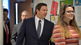 Gov. Ron DeSantis enters a classroom at Ida S. Baker High School in Cape Coral.