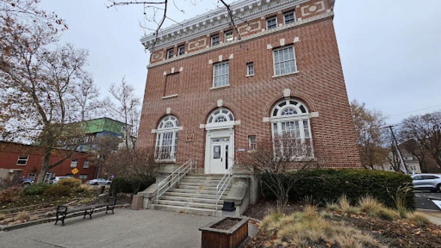 an outside view of a brick building with stairs