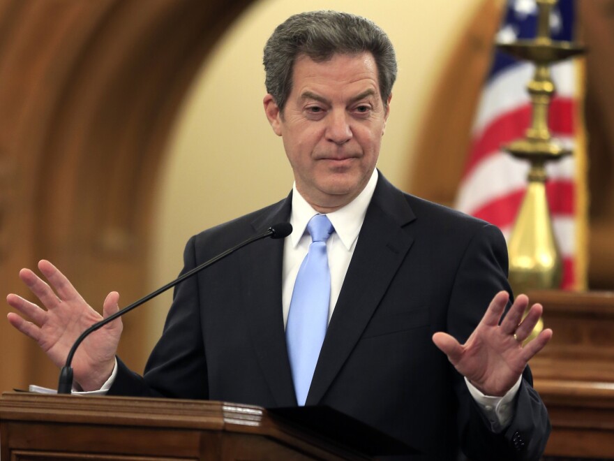 Kansas Gov. Sam Brownback speaks to the state Legislature in Topeka. The state Supreme Court rejected some education funding changes enacted by lawmakers earlier this year and threatened to order the state's public schools closed if inequality is not corrected.