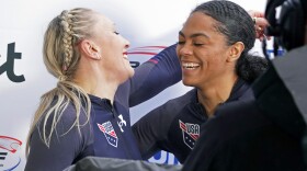 Third placed Kaillie Humphries and Kaysha Love of USA celebrate after their second run of the two-woman Bobsleigh World Cup race in Sigulda, Latvia, Sunday, Feb. 19, 2023. Love is moving from push athlete to driver for the U.S. and will make her World Cup debut as a pilot next month with hopes of moving closer to a spot in the 2026 Olympics.