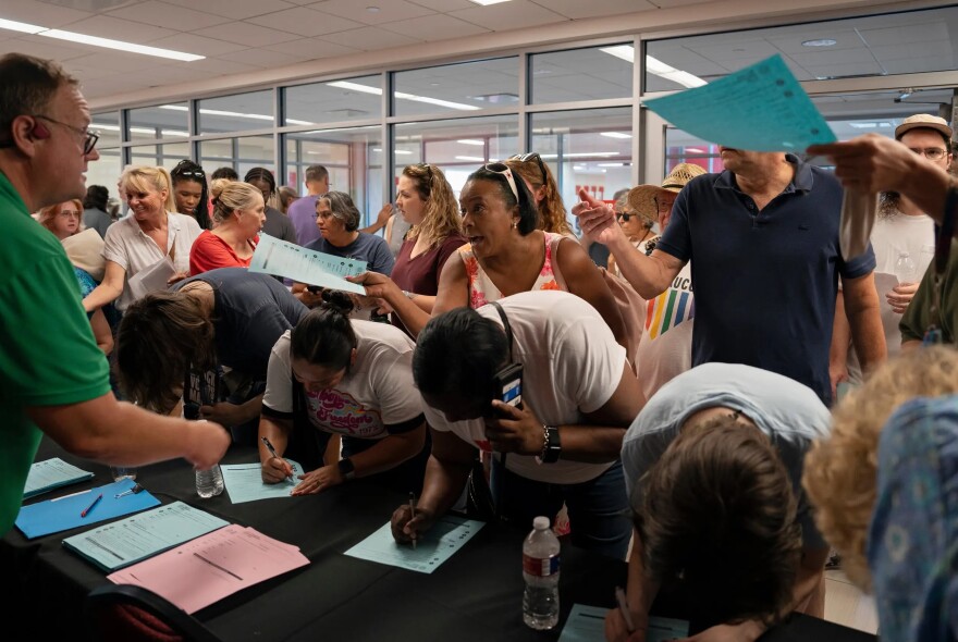 People sign up to speak at a congressional redistricting hearing at the University of Houston campus on July 26, 2025.