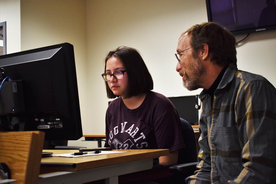 Amber Redneck works on a bit of code with help from instructor Thomas Trickel on day three of Native Tech Camp in Pablo June 13, 2018.