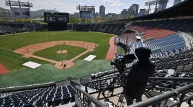 Professional sport returned to South Korea on April 21 as coronavirus restrictions ease, with the first pitch thrown in a baseball preseason derby in front of empty stands. (Jung Yeon-je /AFP via Getty Images)