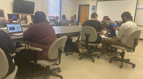 In small groups, student journalists try to find their consensus candidate. 