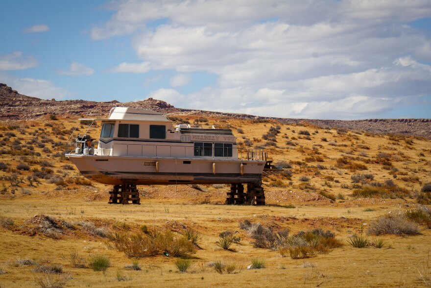 A houseboat sits in dry storage near Ticaboo, Utah, April 28, 2026.