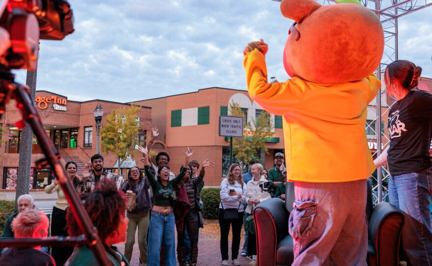 Excited attendees of the Michigan State University Homecoming Parade react to PBS KIDS character Arthur riding on the WKAR float in East Lansing, Mich., on Oct. 9, 2026.