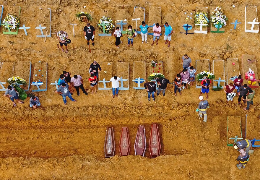 Aerial picture of a burial at the Nossa Senhora Aparecida cemetery in Manaus, in the Amazon forest in Brazil. COVID-19 cases have surged in the area.