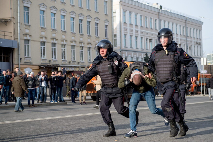 Riot police officers detain a protester during an unauthorized anti-corruption rally in central Moscow on March 26, 2017.
Thousands of Russians demonstrated across the country on March 26 to protest at corruption, defying bans on rallies which were called by prominent Kremlin critic Alexei Navalny -- who was arrested along with scores of others. (Alexander Utkin/AFP/Getty Images) 