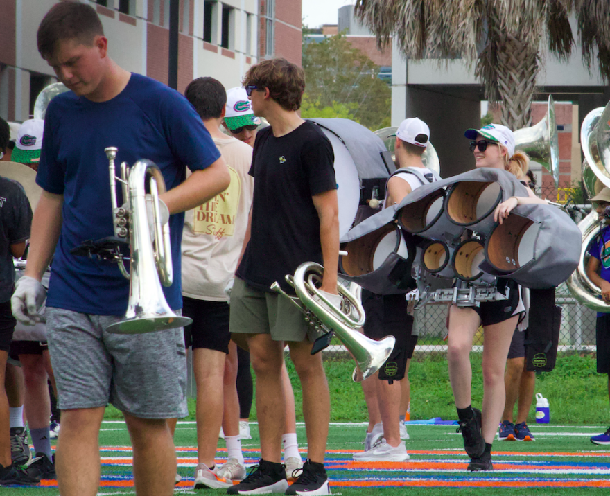 Students wait between reps during a Gator Marching Band rehearsal on Oct. 1, 2024. (Aimee Sullivan/WUFT)