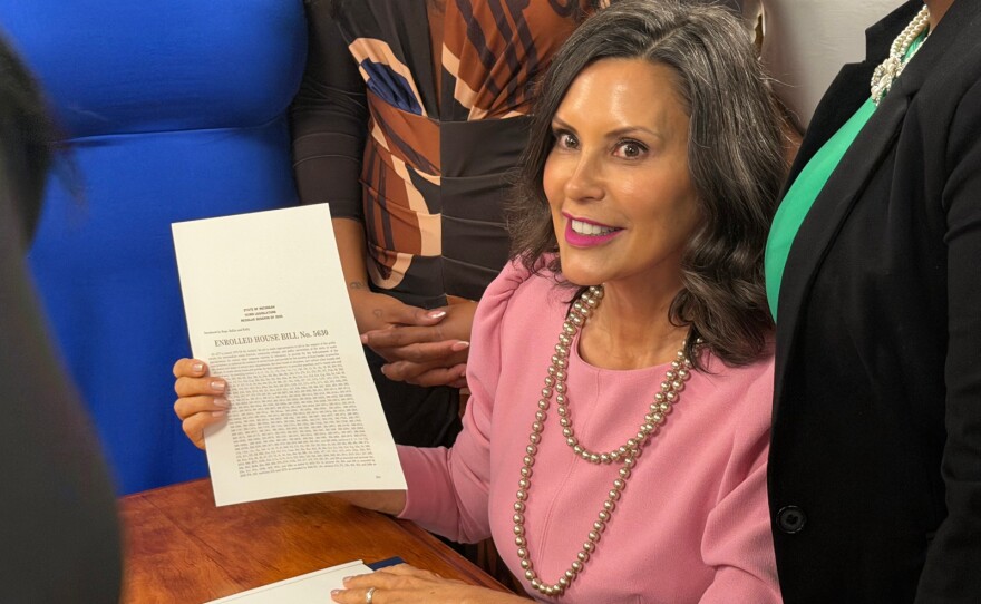 Governor Gretchen Whitmer signed the new Michigan school aid budget Tuesday surrounded by teachers, students, and legislators at a school in Southfield