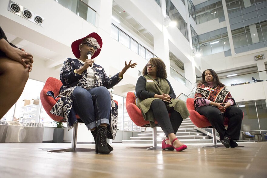 Left to right: Omisade Burney-Scott, a social justice advocate, Kara Hollingsworth with Lead NC, and Cheryl Carter Ellis with Democracy North Carolina talk with other black women during a Sister to Sister salon conversation at the Chesterfield in Durham o