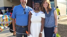 Aline Umwamikazi, on the day she graduated from Belmont High School. She's pictured here with her friend Jamie Cason and Jamie's husband.