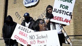 Imani Mohammed-Denny, mother of Aseelah Mohammed who was found dead in a New Haven facility for the homeless, protests outside the New Haven Police Department. She claims the police are not treating her daughter's death as a murder and said police are not doing enough on March 21, New Haven, Connecticut.