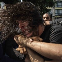 Plainclothes police detain an anti-government protester during a protest in Havana, Cuba, on Sunday. Hundreds of demonstrators went out to the streets in several cities in Cuba to protest against ongoing food shortages and high prices of foodstuffs.