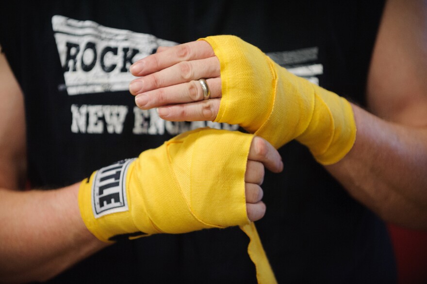 Quaglia unwraps his hands after a punching exercise.